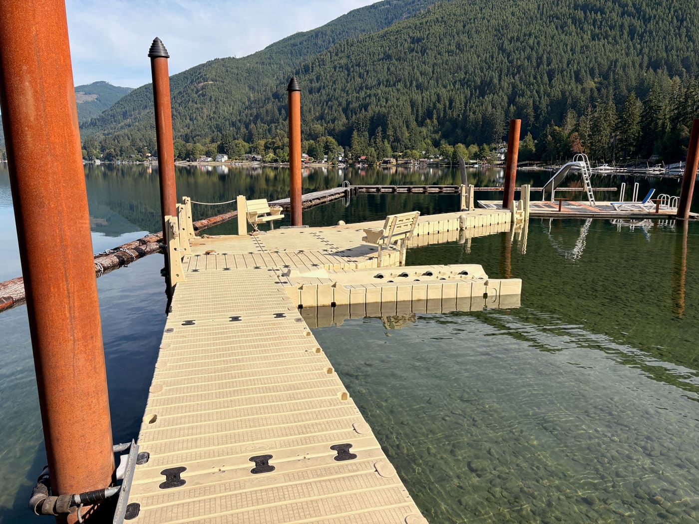 Piling-anchored residential dock with slide
